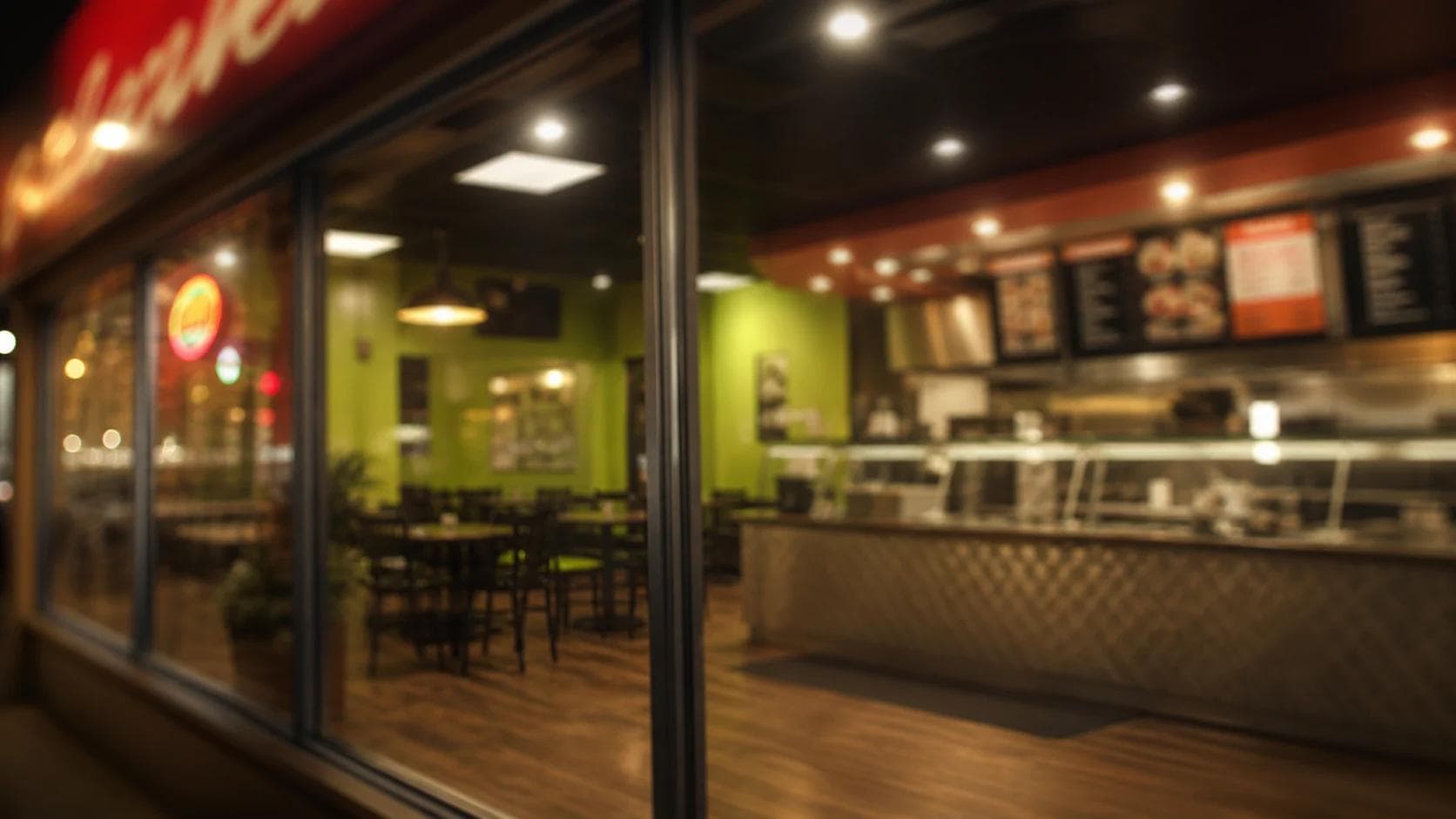 A warmly lit Lazeez restaurant interior at night