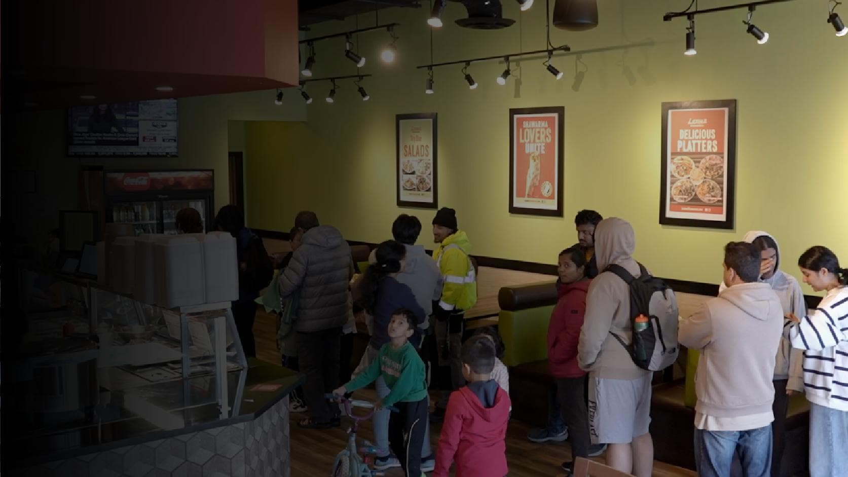Inside a Lazeez Location with a large line of people