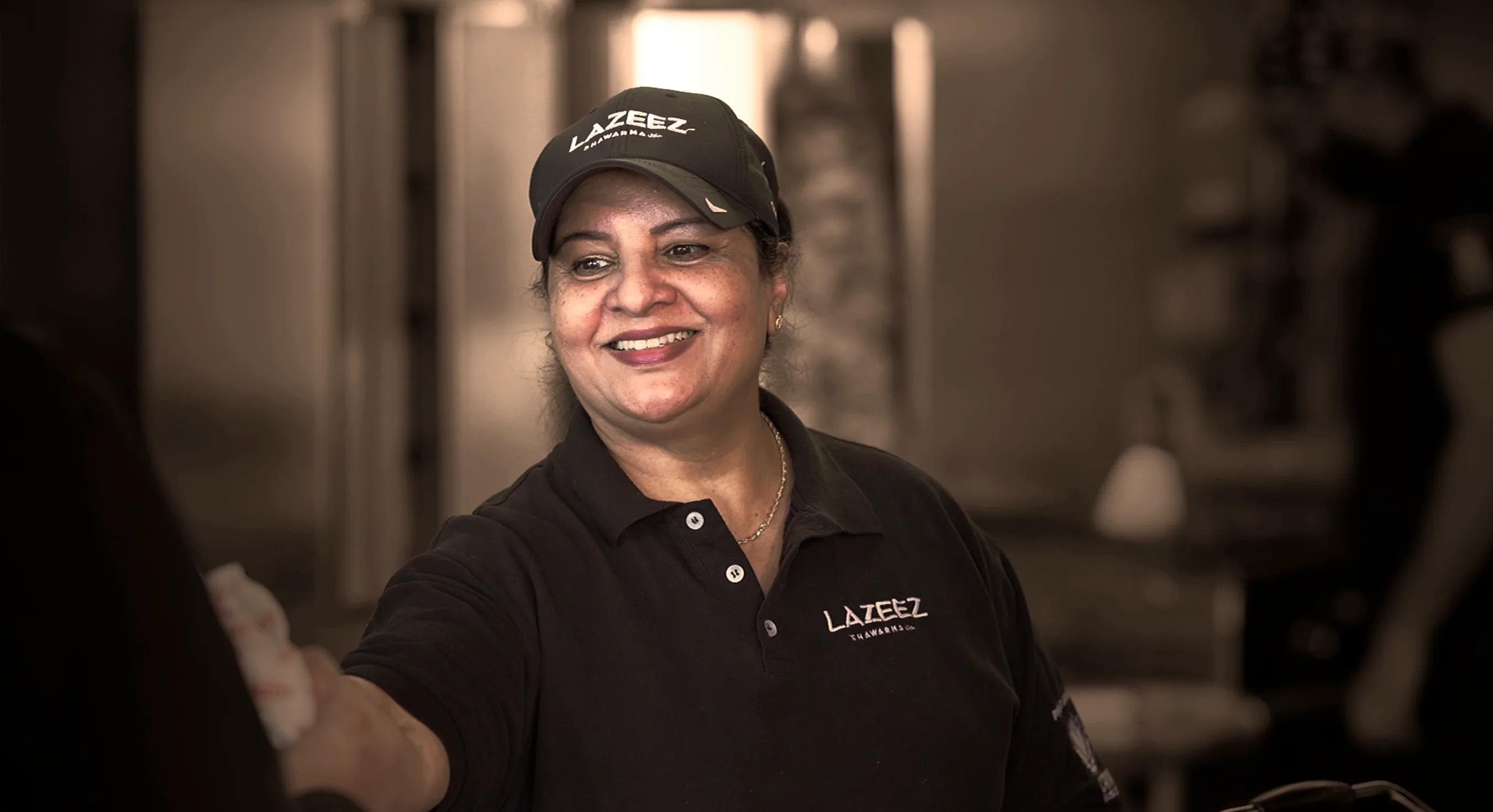 Lazeez team member sharing a meal